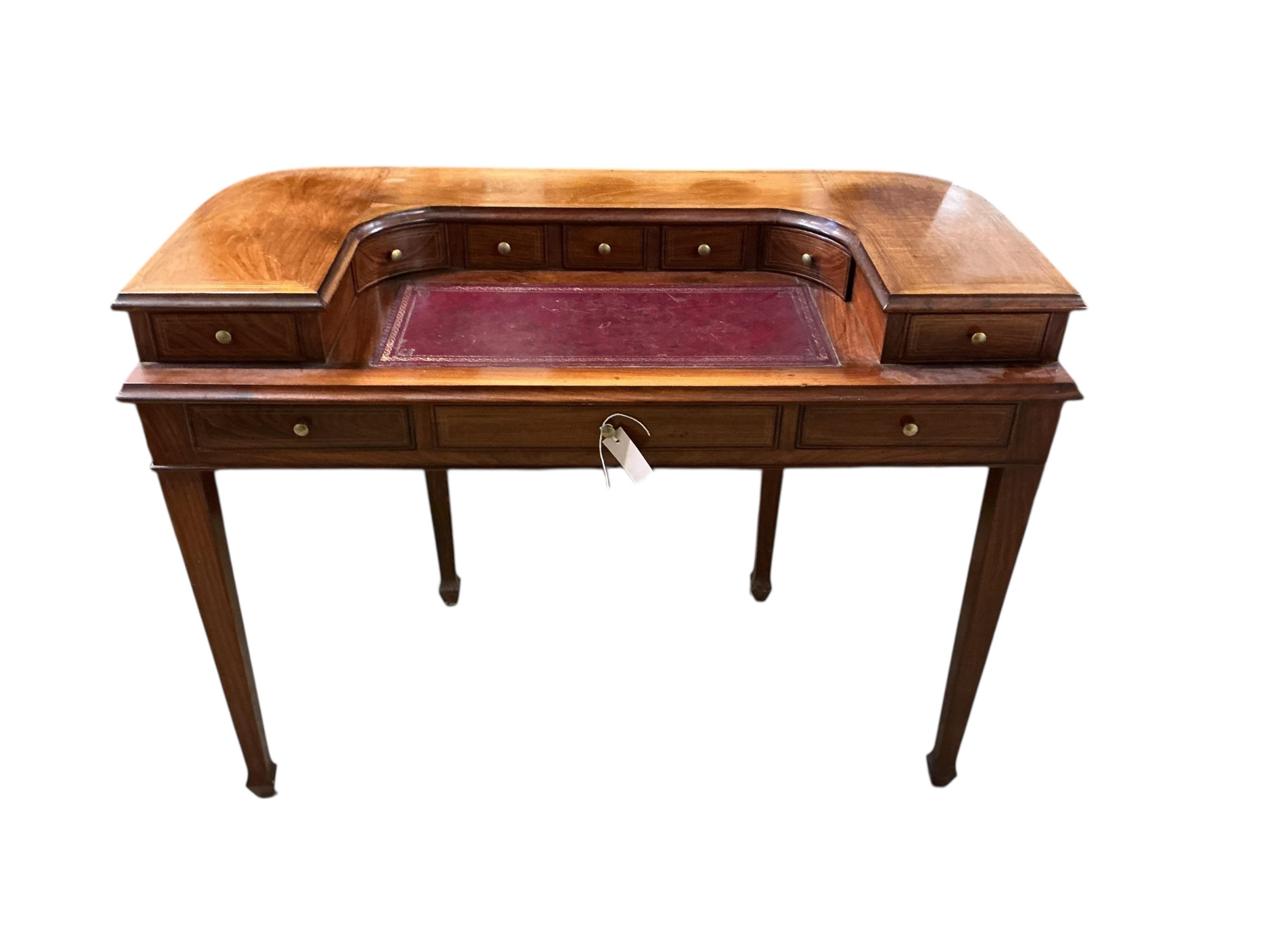 A reproduction brass inlaid mahogany Carlton House type desk, width 116cm, depth 54cm, height 87cm